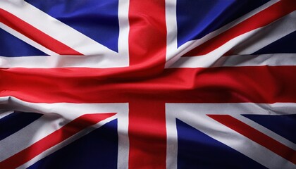 Fototapeta premium The Union Jack in Dynamic Fabric Waves. Timeless Representation of British Unity, Heritage, and Identity Educational Displays, Cultural Celebrations, Historical Contexts, or Artistic Inspiration