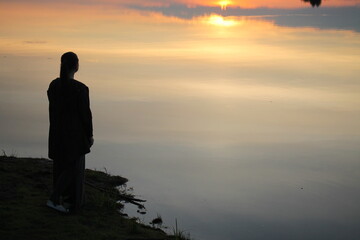 Fototapeta premium Silhouette on the background of the sky and the sunset.