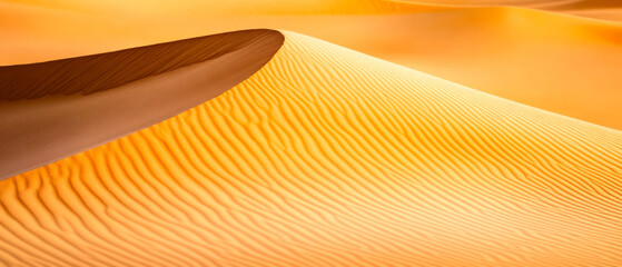 A serene landscape of golden sand dunes, showcasing gentle curves and textured patterns under warm...