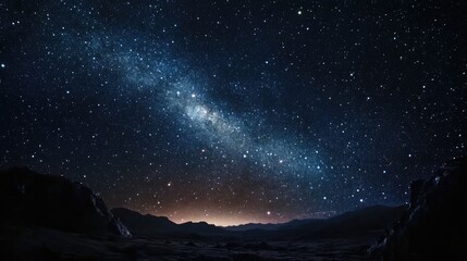 A breathtaking night sky showcases a dazzling array of stars against a deep blue backdrop, creating a beautiful cosmic scene filled with serenity and wonder.