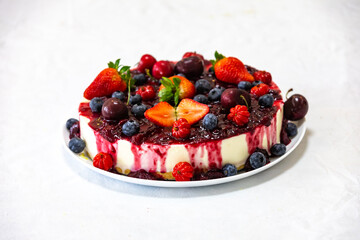 Traditional red fruit cheesecake with creative and luxurious decoration