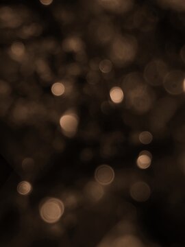 Brown bokeh lights background imgae.