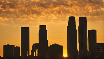 Detroit skyline silhouette of detroits renaissance center with vintage cars below a golden sunrise, Ai generated