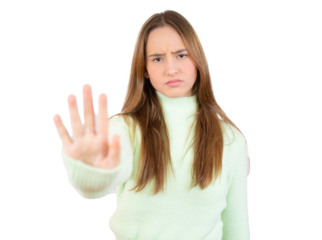 Portrait of a serious young woman showing stop gesture with her palm isolated over white background. PNG transparent