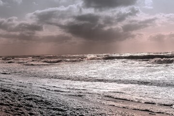 Fototapeta premium Strong storm clouds with strong wind on the beach on Sylt