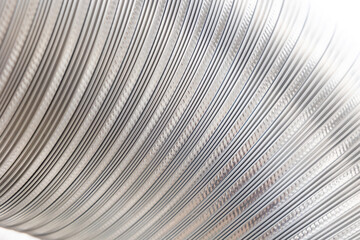 Obraz premium Flexible corrugated aluminum tube texture. Shiny silver foil banner background