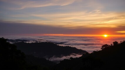 Obraz premium Breathtaking Sunrise Over Misty Mountains: Capture the Serene Beauty of Nature's Dawn