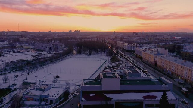 The aerial video of sunset at Petrozavodsk, Karelia, Russia, with the winter scenery, city streets and view over Onega lake.
