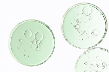 The texture of a cosmetic serum or body gel in a Petri dish.
