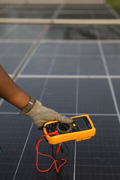 Technician in a solar panel powerhouse in Gounsoe village, Dassa, Collines, Benin