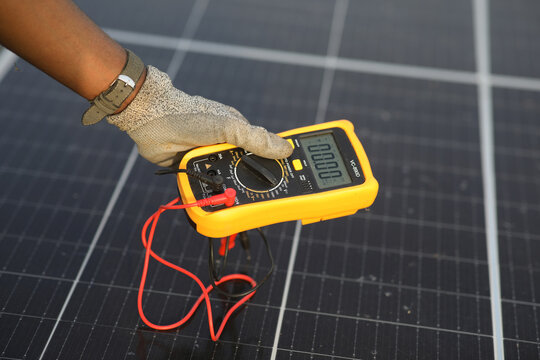 Technician in a solar panel powerhouse in Gounsoe village, Dassa, Collines, Benin