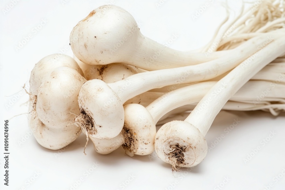 Poster close-up shot of a bunch of white garlic on a white surface, perfect for use in recipes or as a deco