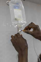 NurseÕs hands with a drip in a private hospital in Accra, Ghana