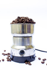 Modern electric coffee grinder with robusta coffee beans isolated on white.