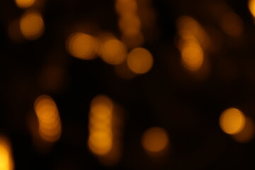 Red and fire orange bokeh on a black background, bokeh abstract background, modern abstract backdrop. Orange Christmas background, Xmas backdrop. Halloween scary concept, Halloween bokeh background
