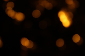 Red and fire orange bokeh on a black background, bokeh abstract background, modern abstract backdrop. Orange Christmas background, Xmas backdrop. Halloween scary concept, Halloween bokeh background
