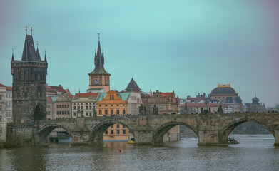 Charles Bridge in Prague in late rainy autumn.