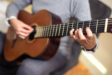Fototapeta premium Mature Woman Playing Guitar At Home