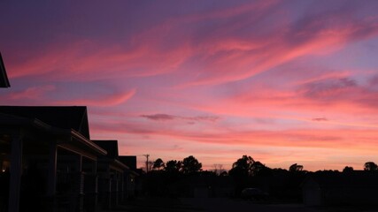Obraz premium Neighborhood at twilight with pink clouds fading and porch lights glowing, glow, twilight