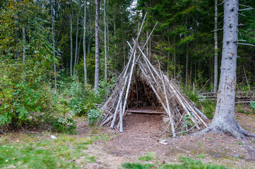 Wooden wigwam made from wooden sticks. Tadu nature study trail, Estonia.