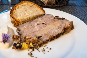Terrine foie gras fat liver specialty food product made of liver of a duck or goose fattened by force feeding, served in French restaurant in Perigoed, Dordogne, close up © barmalini