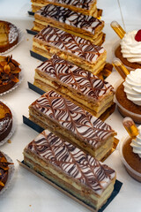 Portion of french mille-feuille cake, vanilla or custard slice, Napoleon puff pastry layered with pastry cream in bakery