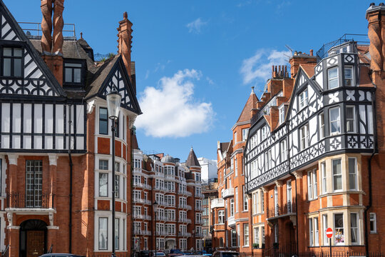 Red bricks houses on Hans Crescent street in Royal Borough of Kensington and Chelsea, London, UK