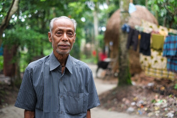 Portrait of a south asian rural senior man in half sleeve shirt