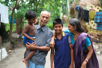 South asian hindu religious rural grandparents having fun with their grandchildren 