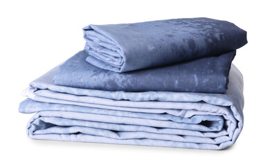 Stack of clean bed linen isolated on white