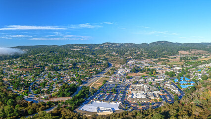 Drone view of Carmel Valley, California with city and mountains