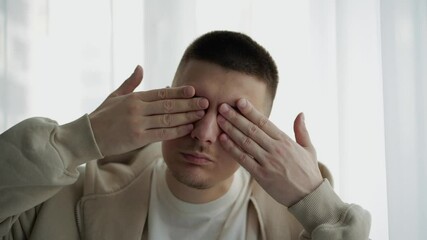 The man covers his eyes with his hands and pretends that he doesn’t see anything.
Social problems.
A person closes his eyes to problems.
Hands over eyes.
Eyes, close, hands, eyelids