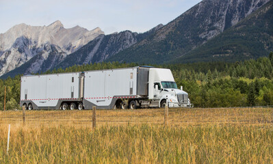 Heavy Cargo on the Road. A truck hauling freight along a highway. Taken in Alberta, Canada