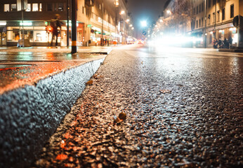 Close up of a wet road at night