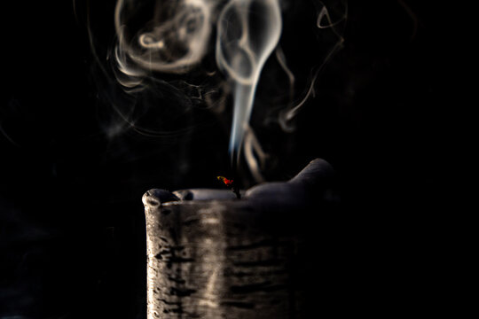 Candle smoke. Candle on black or gray background, sad photo - Photo often used at funerals. aAlso matches Advent's time. Awesome candle smoke in the night when everything dark.