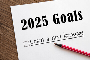planner of goals and plans for 2025, a sheet of paper with text learn a new language from to do...