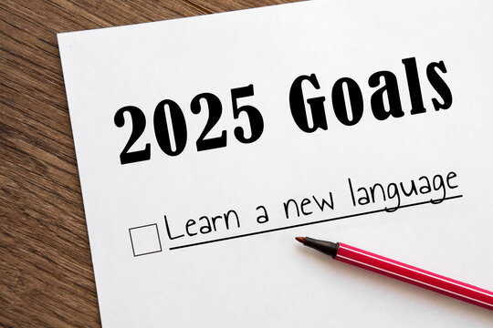 planner of goals and plans for 2025, a sheet of paper with text learn a new language from to do list. planning concept, New Year's resolutions plan.