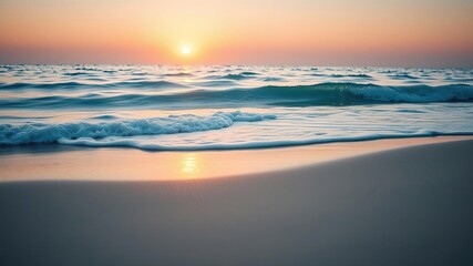 Fototapeta premium A soft blue ocean wave breaks on the shore of a tranquil fine sandy beach at sunset, creating a beautiful and serene scene, fine sandy beach, calm sea, soft blue ocean wave