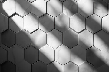 Naklejka premium Sunlight streams across a wall of hexagonal tiles creating striking geometric shadows