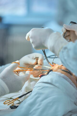 close-up of objects and hands in the operating room