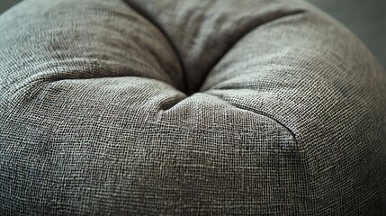 Close Up View Of A Gray Textured Fabric Pouf