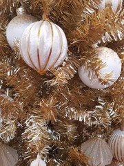 Christmas tree decorations close up. Festive background and Christmas decoration. Beautiful Christmas balls on a decorative Christmas tree.