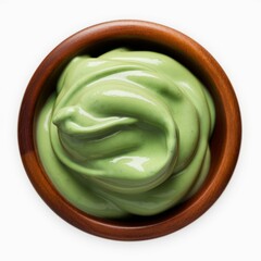 Green Matcha Cream in Wooden Bowl: A close-up, top-down view of a bowl of smooth, vibrant green matcha cream in a rustic wooden bowl.