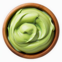 Obraz premium Creamy Matcha Delight: A rich, vibrant green matcha cream swirls invitingly in a rustic wooden bowl, promising a luxurious and flavorful experience.