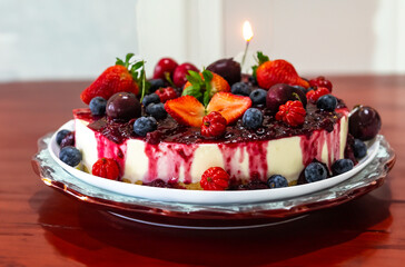 Traditional Christmas red fruit cheesecake with creative and luxurious decoration