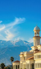 Fototapeta premium Majestic building against a snow-capped mountain range under a vibrant blue sky. AI.
