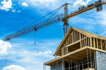 crane lifting cabin roof truss into position