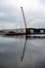 Fototapeta premium Loading cranes of the VCK Logistics company in the Bering and Suez port of Amsterdam, Netherlands