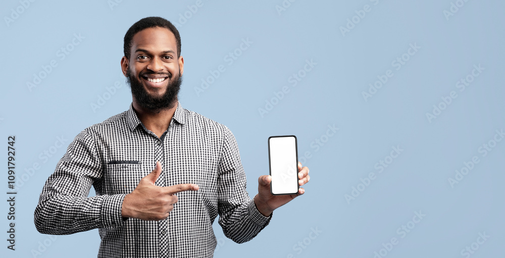 Poster i like this cellphone. smiling african guy showing smart phone with blank white screen, indicating i