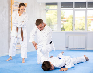 Two men during classes, training improve and practice wrestling with opponent in technique of...